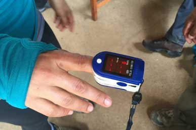 Guide monitoring climber for AMS symptoms